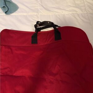 Red Garment Bag with Black Handles